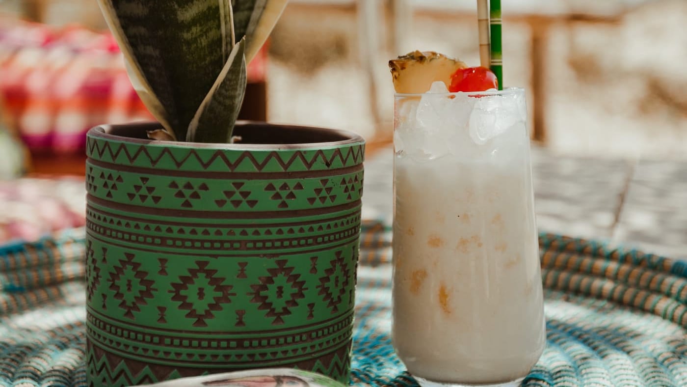 A frozen smoothie on a woven tray at tohu