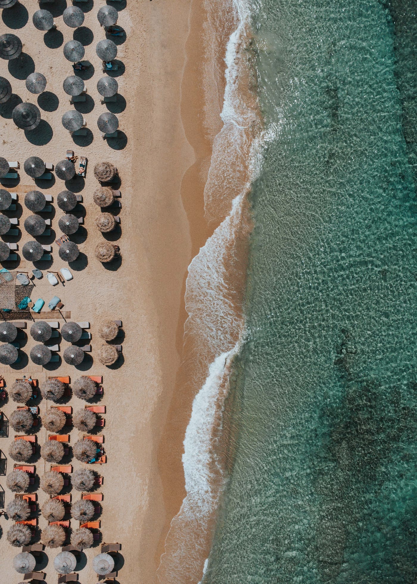 Aerial view of waves breaking along the beach