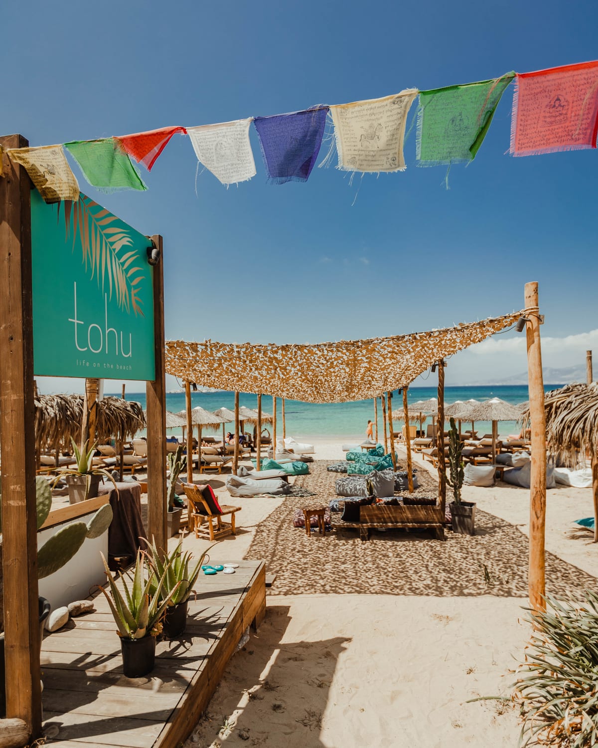 The tohu beach setup with sunbeds facing the turquoise sea